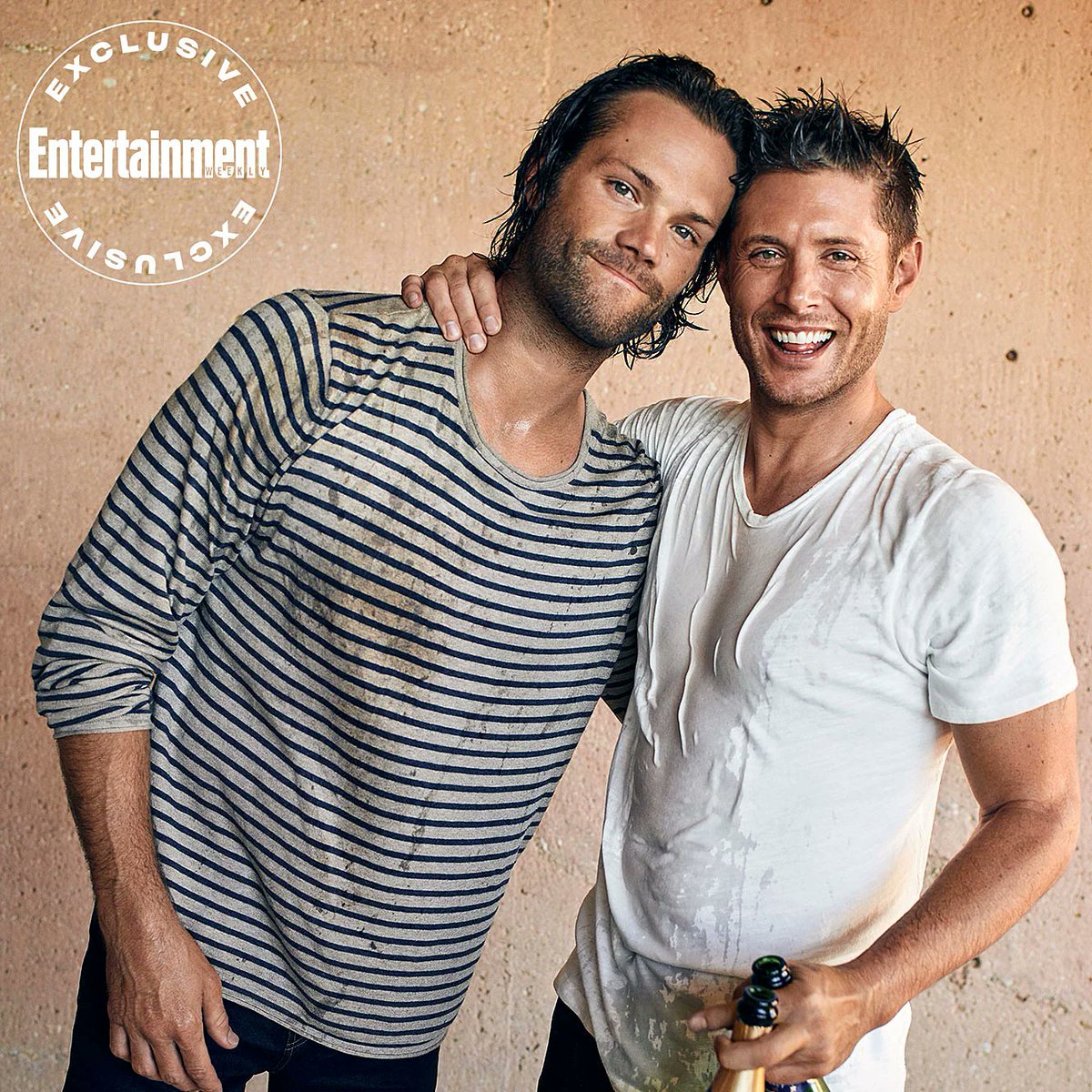 Also whoever decided <a href="/JensenAckles/">Jensen Ackles</a> should wear a white tee shirt to take a champagne shower is a genius. (I do love <a href="/jarpad/">Jared Padalecki</a>'s shirt too - there's so much joy in this picture!) #Supernatural #SPNFamilyForever