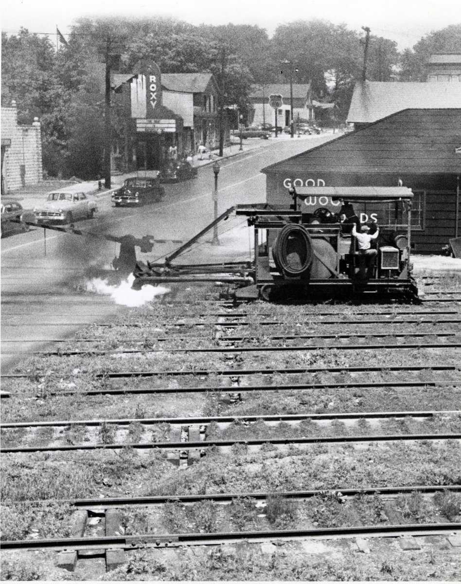 WeGoHistory's tweet image. #TrainTrackTuesday 1952 track cleaner on the C&amp;amp;NW tracks just south on Washington St, photo by Martin Brady. You can see the Roxy Theater and Day's Service Station. This shows the many more tracks than we have today! #Railroadhistory #localhistory #MuseumFromHome #WestChicago