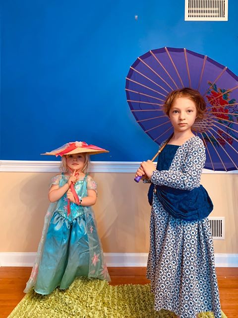 Lena and her daughters dressed up as Claude Monet’s “Woman with a Parasol - Madame Monet and Her Son” (1875).