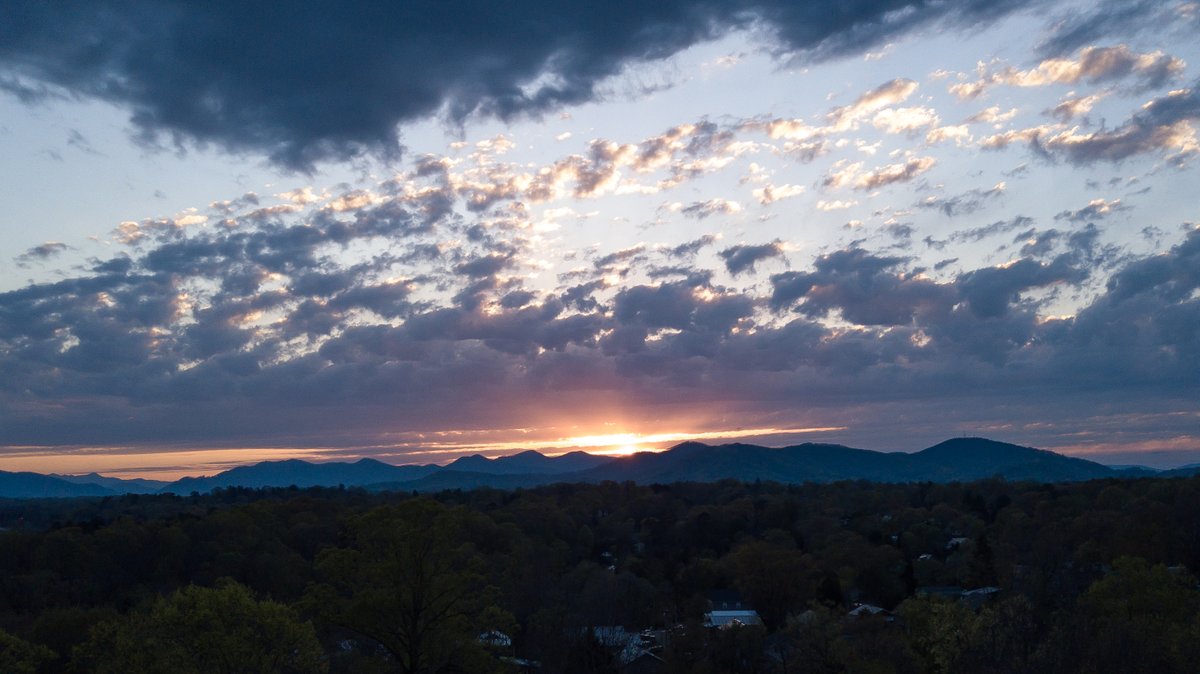 The view from #WestAsheville just above the trees in my yard!  #Asheville #BlueRidgeMountains #Sunsets