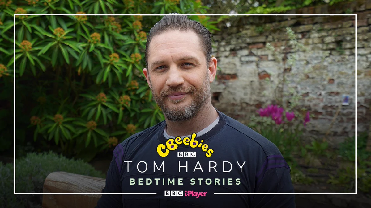 New Tom Hardy Bedtime Stories pic in garden.