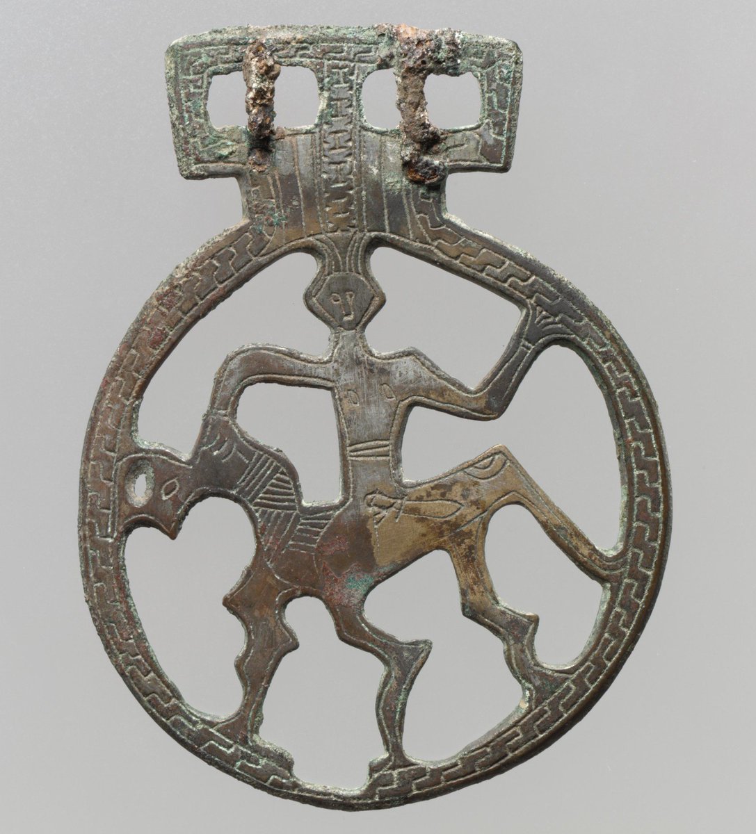 These examples are all in the Metropolitan Museum of Art, with a 7th - 8th century date. They are key rings, basically, hung from the belt, with tools, keys or ornaments hanging from the different loops. In some places, the wear marks are really clear. Copper alloy, often tinned.