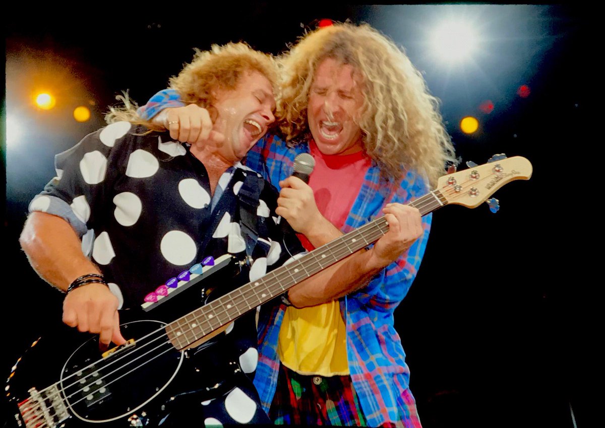 Michael Anthony and ⁦<a href="/sammyhagar/">Sammy Hagar</a>⁩ sharing a mic; and the same hairdresser.