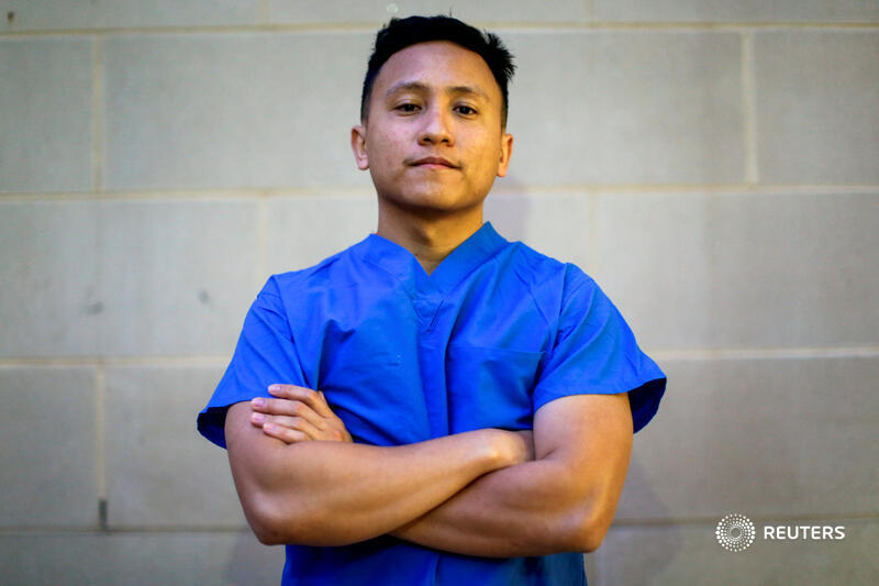 'The hardest moment during the shift was just seeing COVID patients die helpless and without their family members beside them,' says Ernest Capadngan, a nurse in the hospital's biocontainment unit 2/5