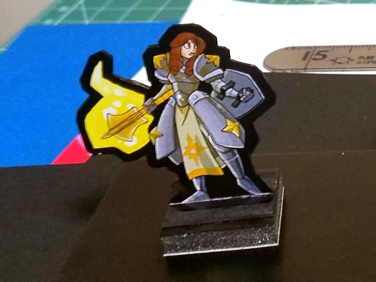 I'd say these paper minis are close to 1mm thick. Which was intentional as they're being given to a three year old.Also?I went over the Knight's hair with brown COPIC marker. My kid picked her because she looks like Anna (from FROZEN), so let's really make her look the part.