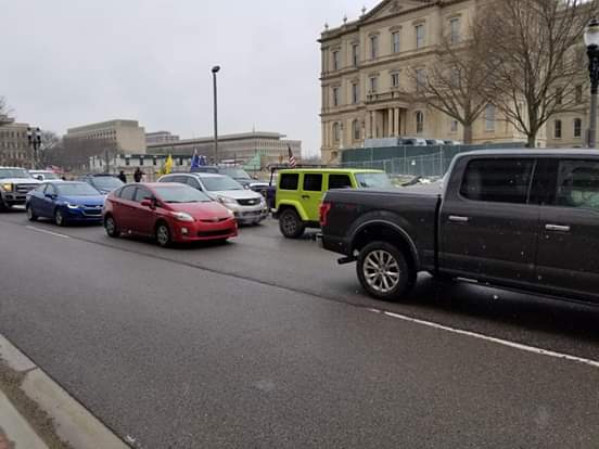 Happening in Lansing, MI This is getting big. Thousands of cars are rolling into town. State Police are closing off exits around the city. I'm proud of my state right now.