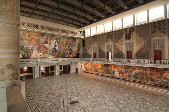 In the town hall in Oslo, in the great hall where the Nobel peace prize is awarded, is a vast mural.