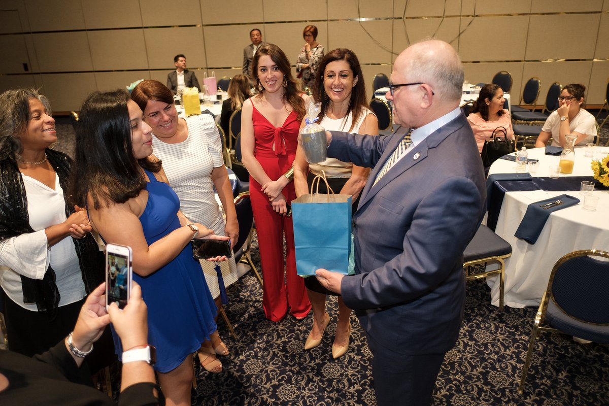 MBR accepts a gift from Cohort I of UP Labs on graduation day!