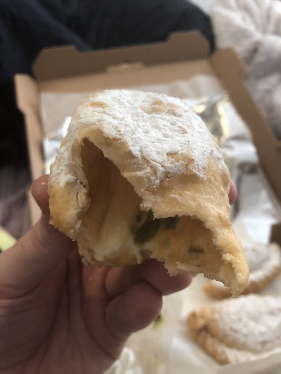 The Russian roulette continued. We clinked our powdered empanadas like they were glasses of champagne. And then we took a bite. Hers: oreo, like she’d ordered. Mine: the missing four-cheese jalapeño that had not come up yet. Topped with powdered sugar. 11/