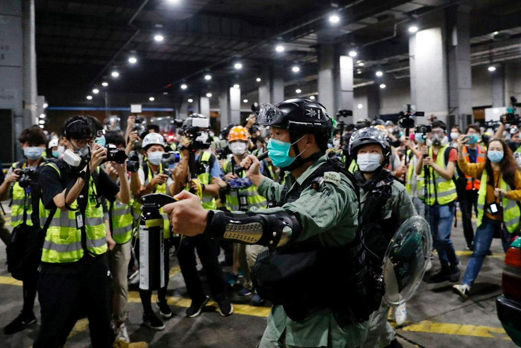 Reuters's tweet photo. Hong Kong? Bushfires? What's been happening on the biggest non-coronavirus stories of the year https://t.co/GXMkJ95rSr https://t.co/9MiijuUQsQ