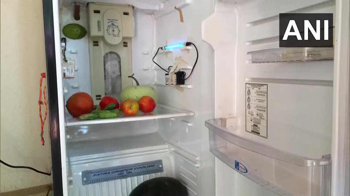 ANI's tweet photo. Karnataka: Dr. Arun M Isloor,head of Chemistry Department, National Institute of Technology Karnataka (NITK), Surathkal, along with research scholar Syed Ibrahim developed a disinfection chamber out of an old fridge.Dr.Arun M Isloor says,"we have named this as ZERO-COV." #COVID19 https://t.co/mLgLOv38Uz