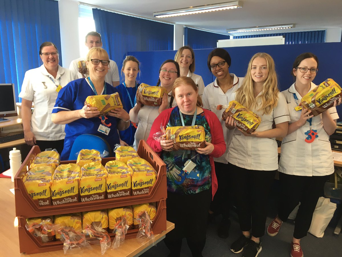 SLT enjoying bread donation from local fruit and veg company Chefs Choice
