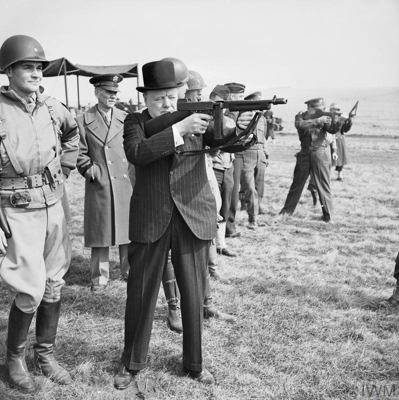 Prompted to look at this well known photo from March 1944. Churchill shooting a Thompson submachine gun; in the background you can see General Eisenhower doing the same. Churchill had been inspecting US forces prior to invasion of France.©  @I_W_M H 36960 https://www.iwm.org.uk/collections/item/object/205195511