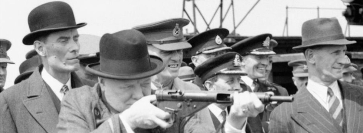 Yet even here, there's still a Thompson of a sort in the image - Churchill's long-serving bodyguard Inspector Walter Thompson, in the pinstriped suit. The bowler-hatted Secretary of State for War, Captain David Margesson, looks on over Churchill's shoulder. /fin