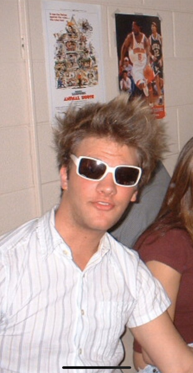 White sun glasses puffed hair weird shirt