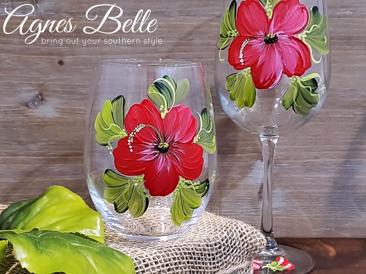 In need of a new wine glass? Our beautiful hand painted hibiscus wine glasses may be just the one for you.  Shop online for curbside pickup.  
.
#agnesbellevp #vintageparkhouston #wineglasses #winelover #gifts #homeaccents #winedown #hibiscus #handpaintedwineglass