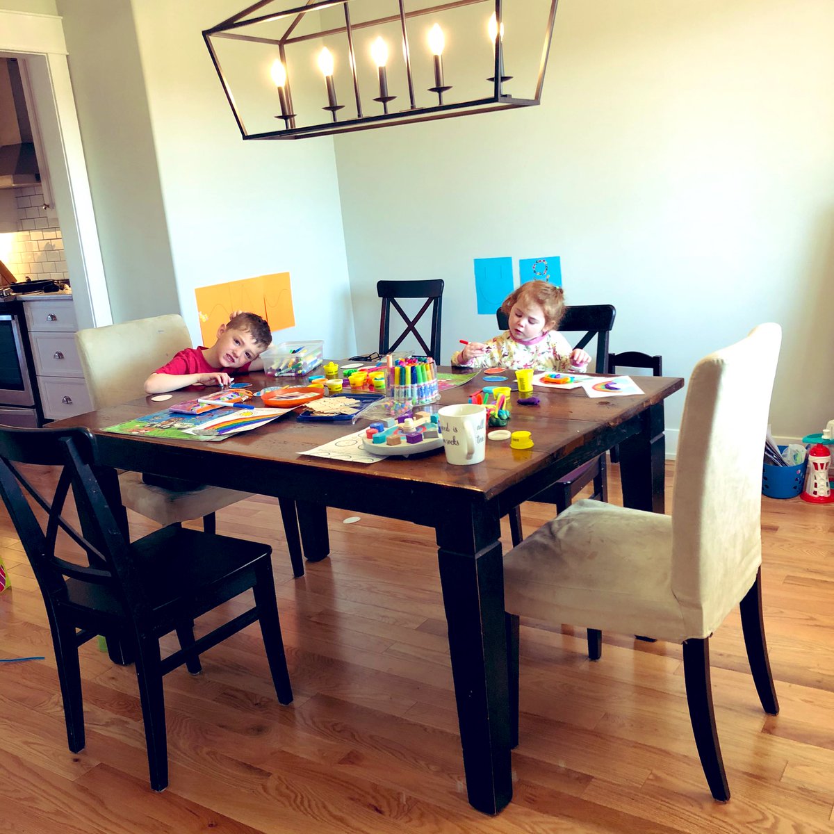 chevy_jenn's tweet photo. Activity/School time at the Moore house. The kiddos are enjoying the extra family time but I must say my coffee intake has increased 10 fold 🤣🤣@HolySpiritOCSB #spiritweek #ocsbAtHome #morecoffee https://t.co/J16FJZDegG