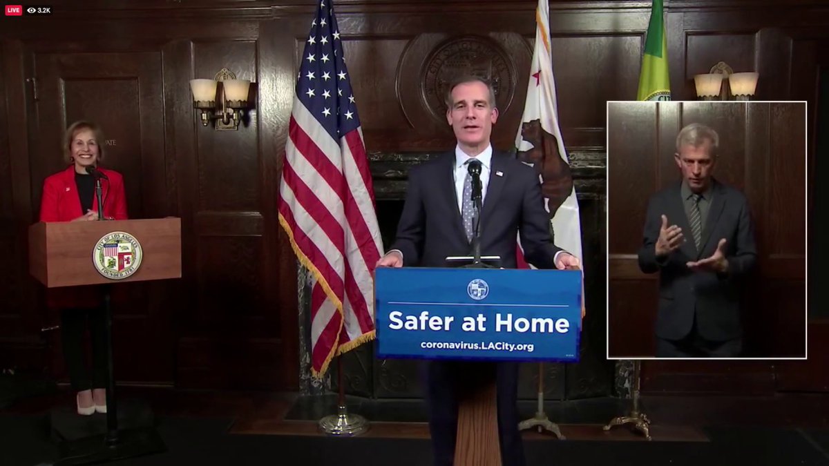 Screen capture of Mayor Eric Garcetti's 4/15/20 press briefing, with USC President Folt in the background