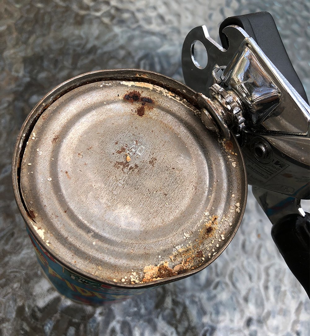 I put the can opener to work, unsettled by the rust, but emboldened by the lack of noxious fumes. I turn the knob and wince, unable to rule out the possibility that the contents have mutated into something alive & malevolent. (2/5)
