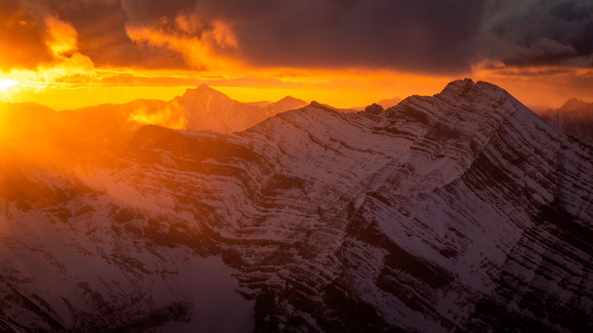 CalSnape's tweet photo. Soaring through the Canadian Rockies at sunrise 🚁 Don't let the photos deceive you though, it was a windy morning and I was trying my best to keep my coffee from coming back up! Between the bumps I managed to get a few photos I liked! https://t.co/4dGr7oWMDf