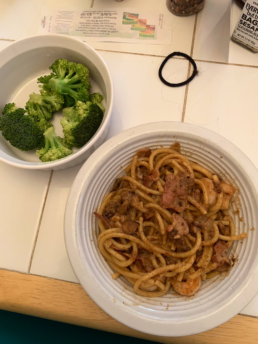 Bucatini Alfredo with mushrooms, old bay shrimp, and bacon, plus a side of broccoli.