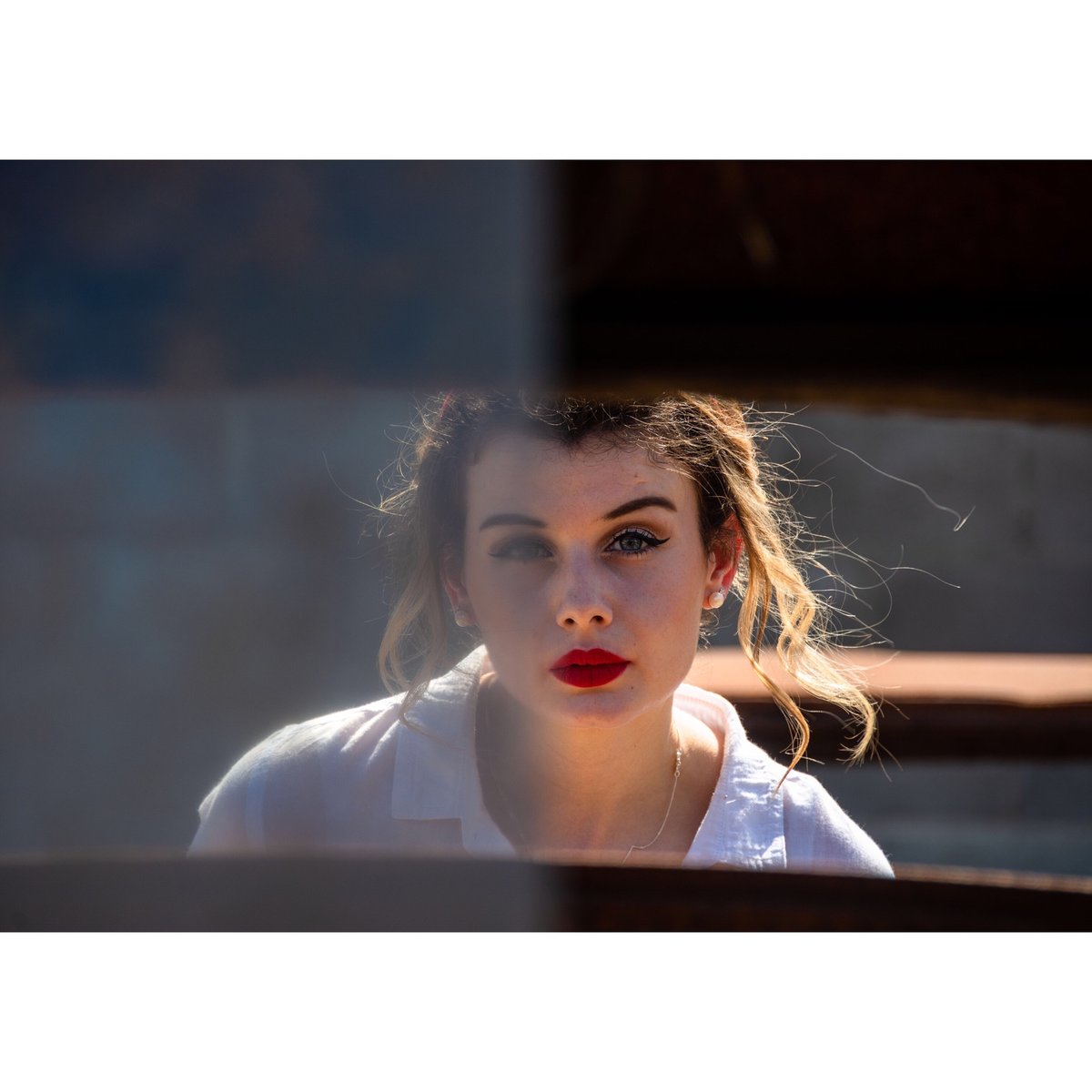 EmilyAdair2's tweet photo. As the model it's sometimes really hard to envision what the photographer wants to do. When @jamesbriggsphotography said stand behind this car with half a windscreen I have to admit I was confused, but this photo ended up being one of my favourite photos. https://t.co/HvBFelsx7g