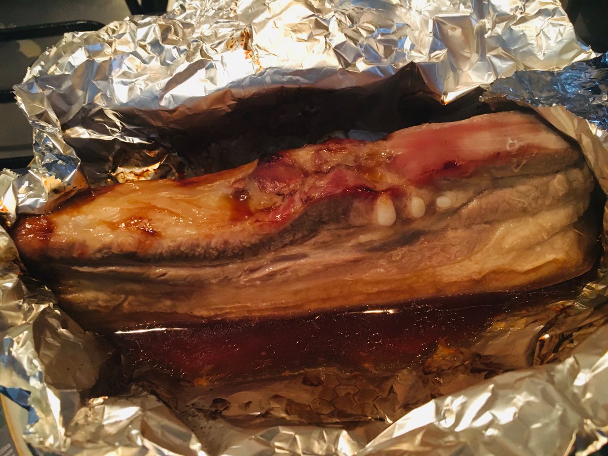 Pork belly, roasted in soy sauce, honey (teeny tiny bit!), vinegar, and I would have added ginger if I'd had some. Fun to eat caveman style; had to wash face afterwards. A bit too chewy, if I'm honest, and I was also too impatient to let the glaze thicken into, well, a glaze. 🐖