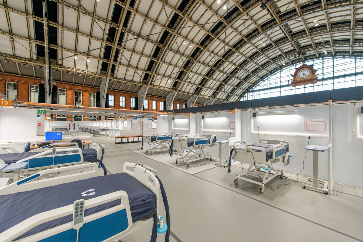 RIBAJ's tweet photo. Assembled in 2 weeks, the NHS Nightingale Hospital Northwest designed by @bdp_com and delivered by joint venture IHP and the Army has just opened. It is in the Grade II* listed 1880 former Manchester Central Station by engineer Sir John Fowler, now a convention centre https://t.co/ETG19G9Mfj