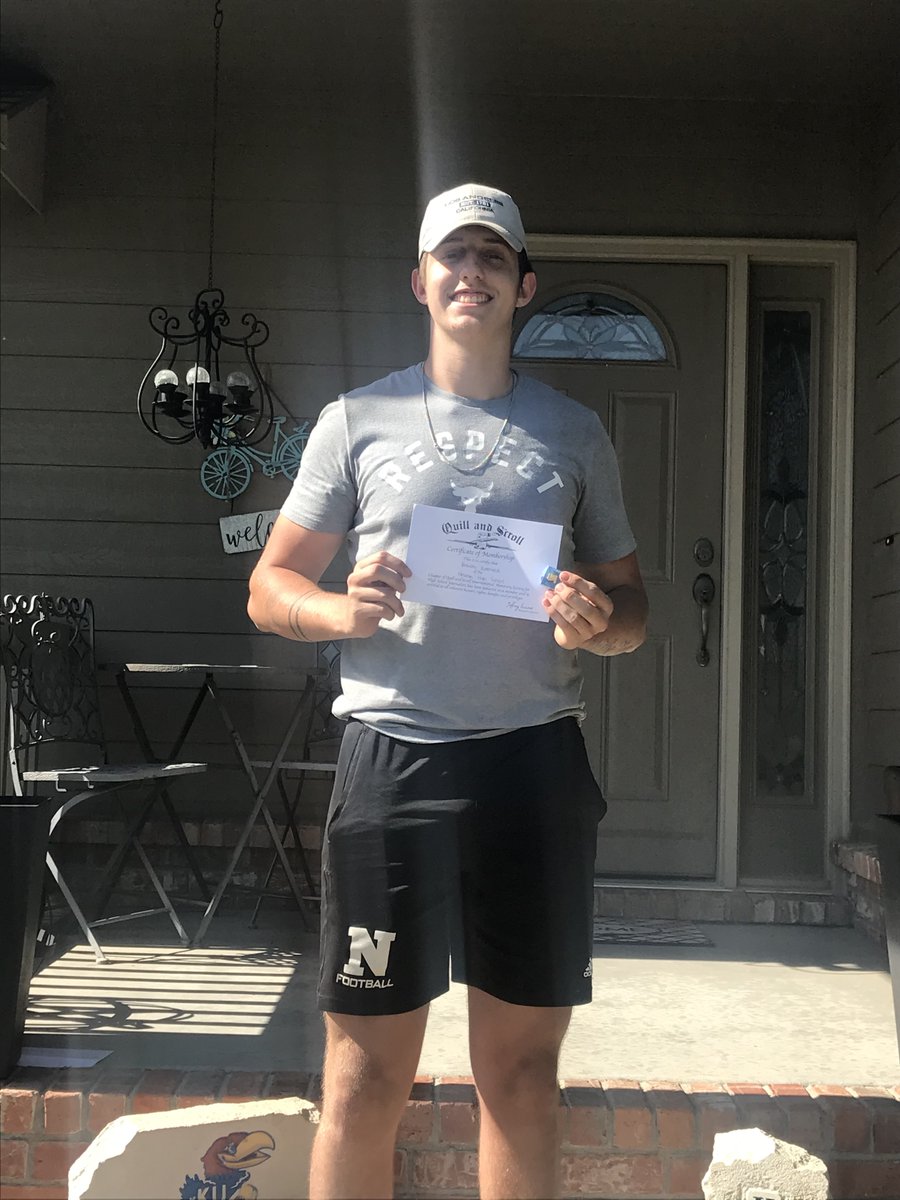 RailerNews's tweet photo. Junior Braiden Botterweck poses with his certificate outside his home. Botterweck is a 2nd year staff member and was inducted this year (with "Africa" playing from Montano's car--yearbook understands.) 🤣😉 https://t.co/m3ONRLkAhP