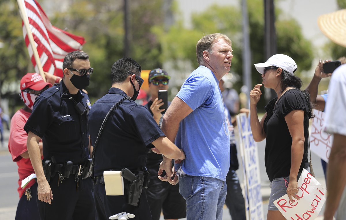 StarAdvertiser's tweet photo. Arrests made at reopen Hawaii rally in front of State Capitol https://t.co/tbOArTOuCK https://t.co/AuHYOrzPhw