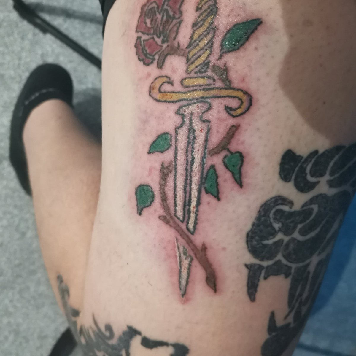 Benware69512337's tweet photo. My latest tattoo from last night what's people thinking #tattoos #tattooart #INKED #InkMaster #dagger #roseanddaggertattoo. https://t.co/A3L0S8JM64