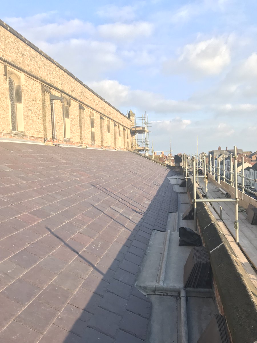 #TBT a sunny day in Great Yarmouth checking in on the team. Full elevation brick repoint, stonework replacements to windows and new slate roof #roofing #stonework #brickwork #heritage #restoration #Churchwork