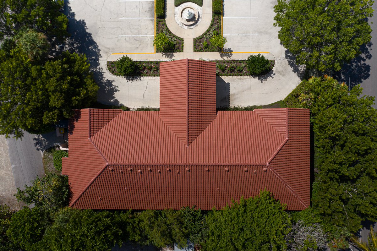 TargetRoofingFL's tweet photo. With multiple peaks and a beautiful red finish, this 6,500 square foot re-roof project for the Boca Grande Health Clinic shows the special care and expertise that is paramount at Target Roofing for every project we take on. #TargetRoofing https://t.co/0EEusY4wTk