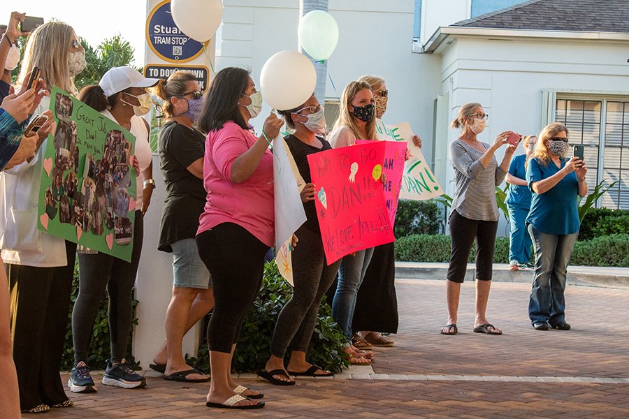 ccmartinhealth's tweet photo. It was an emotional evening on Wednesday as caregivers gathered for a celebratory send-off for nurse Dan Rice after his release from Cleveland Clinic Martin North Hospital. As he continues his recovery from COVID-19, we wish Dan and his family the very best. https://t.co/HLxfc6lvF1