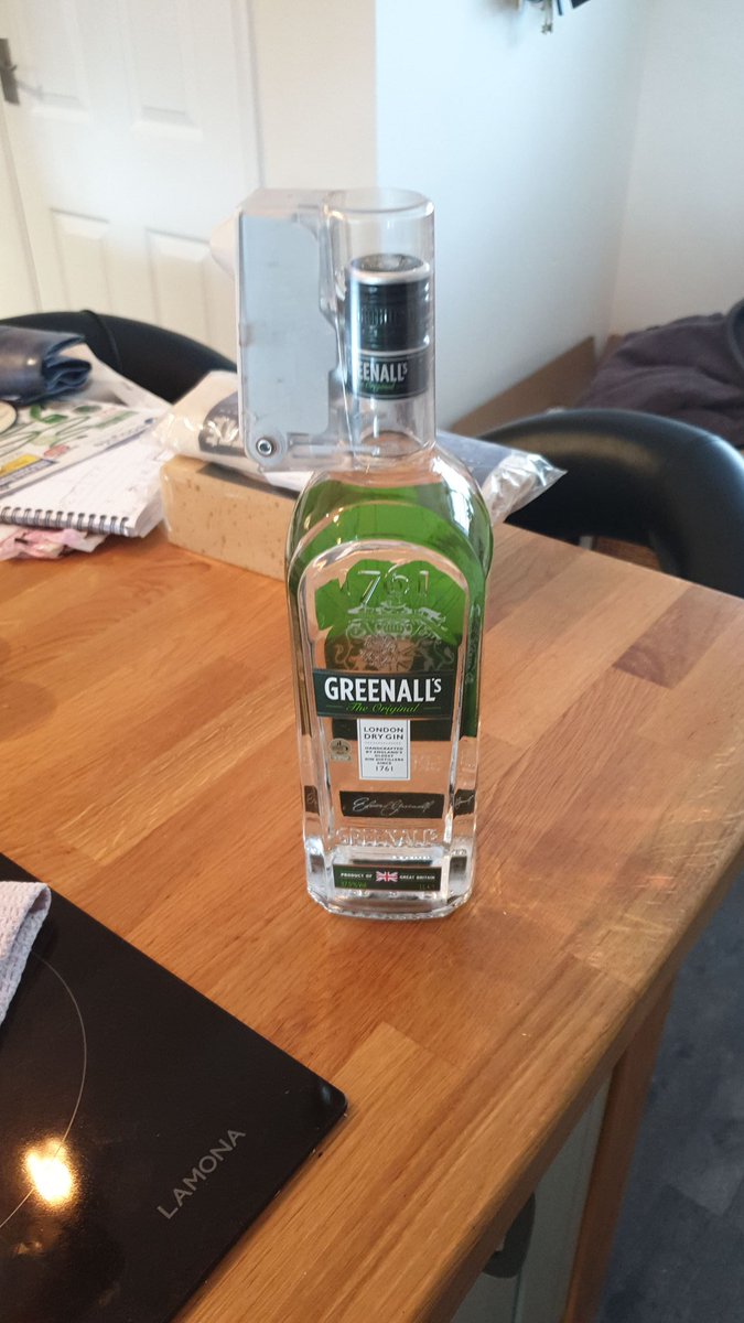 tonymathe34's tweet photo. Finally was able to get a @Morrisons home delivery. The much needed bottle of gin had a tag on it. Morrisons responce to please help was - look on YouTube! Or wait until after #lockdown for a refund. #FirstWorldProblems https://t.co/CAcppDNWyS