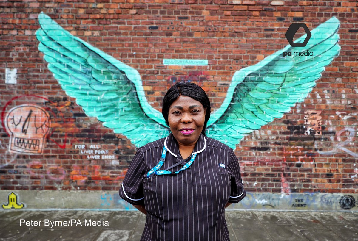 GraffitiPool's tweet image. Amazing images from @Peter_J_Byrne of NHS workers in from of @paulcurtisart ‘Liver Bird Wings’ #NHSHeroes