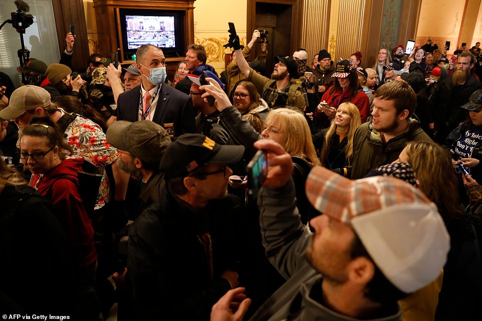 Gina660's tweet photo. @Morning_Joe #MichiganProtesters On those Michigan protesters,or as I like to call it,their dating meet & greet. 🤨 "Come meet your soul mate. BYOG" (bring your own gun) https://t.co/4VSSSzqaSV