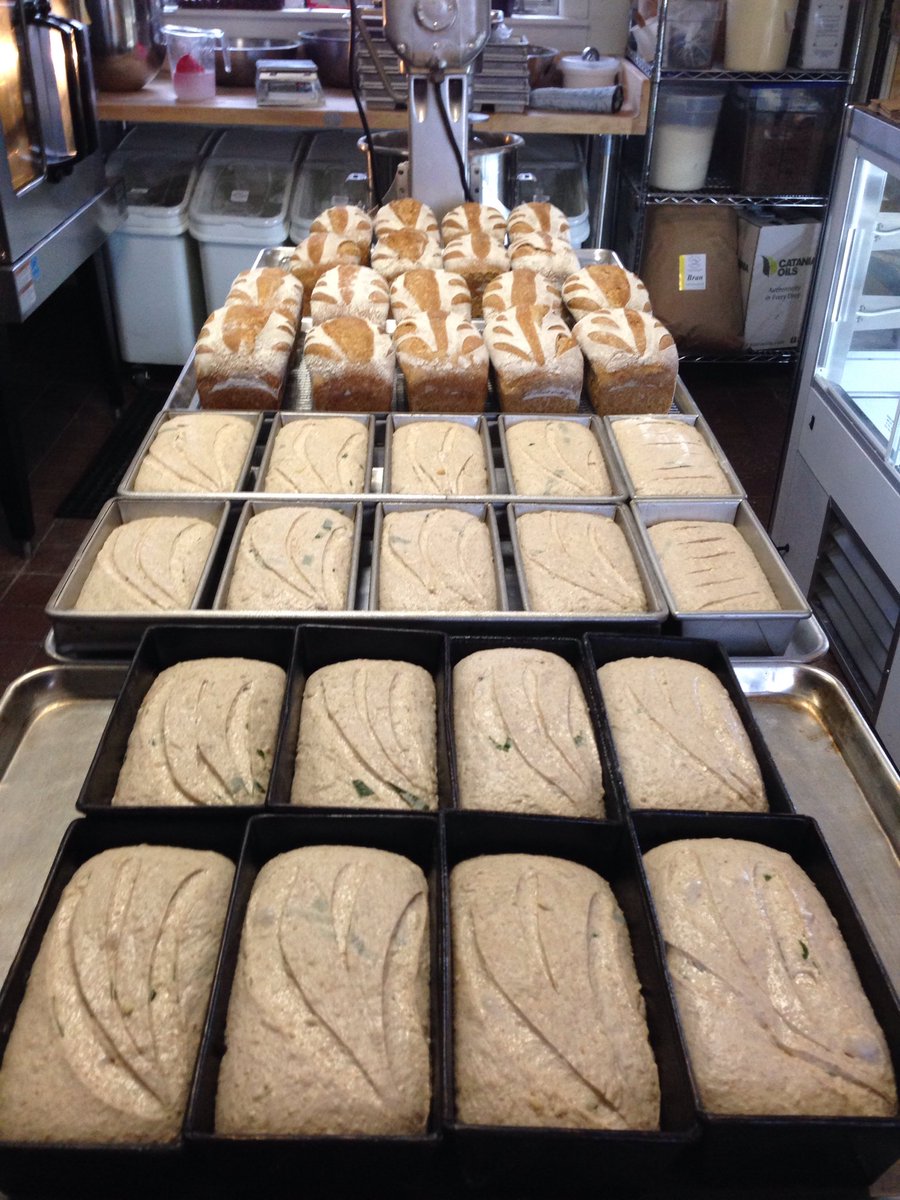 Upinngil's tweet photo. Early morning in the new Little Red Hen bakery. Wheat n Rye sourdough just out of the oven and Wild ramp and cheese about to go in. Finally getting the hang of this new oven! https://t.co/mB4YbHb6Do