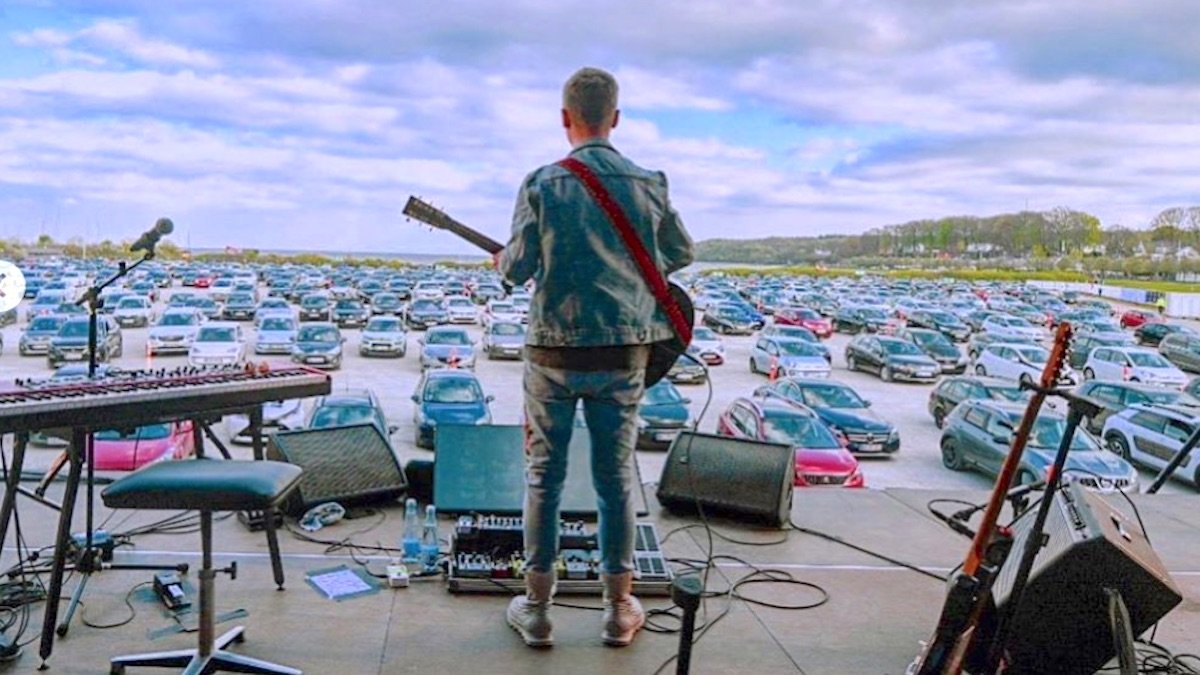 consequence's tweet photo. Drive-in concerts are now a thing in Denmark: https://t.co/4OLOC5lkuC https://t.co/5JtP7aYz72
