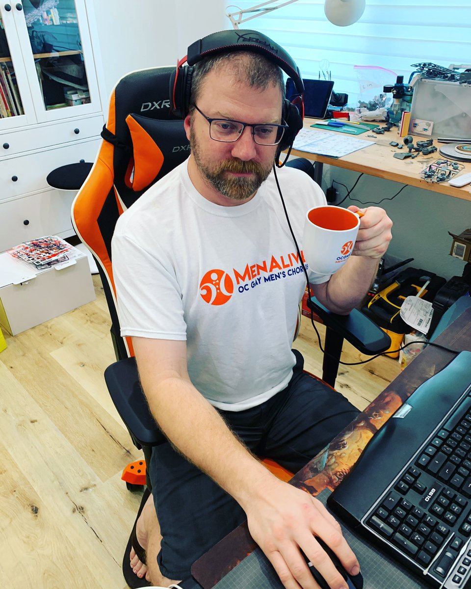 MenAliveChorus's tweet photo. Check out #MenAlive fan, Derek, sporting some MenAlive #swag while working from home, practicing #socialdistancing! Many thanks to Rosie and her husband for their continued support of the chorus and spreading the love for #OCGMC in your home! #menalivefans #weloveourfans #stan https://t.co/YuJpAJe0Iv