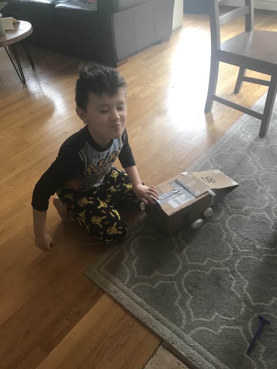 Wayland_CH's tweet photo. This curious Cub built a motor with string to power his Earth Day wagon.  He learned about friction and traction.  #claypitCREATEs https://t.co/c6gWfEYzsp