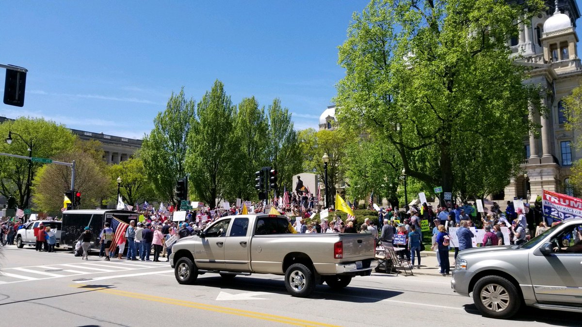 BlueRoomStream's tweet photo. #BREAKING: Outside of the State Capitol, hundreds are protesting @GovPritzker STAY-AT-HOME order. Many individuals are not complying to the 6 foot rule or wearing masks on the day face coverings are officially required in public. Stay tuned: https://t.co/lXN5pzHzah 

#COVID__19 https://t.co/Y2rc4RJJKf