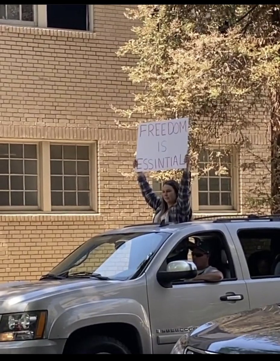 UmairA916's tweet image. We definitely gotta reopen the schools back up for this woman. She needs help spelling. Her phone couldn't help autocorrect on the board #ProtestLockdown