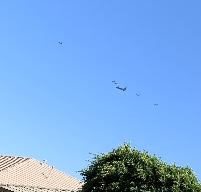 Various air crafts...fighter jets...came out of #Lukeairforcebase to salute the health care workers... this is a (poor) shot from my front yard... very cool! It kinda took my breath away! God bless America!