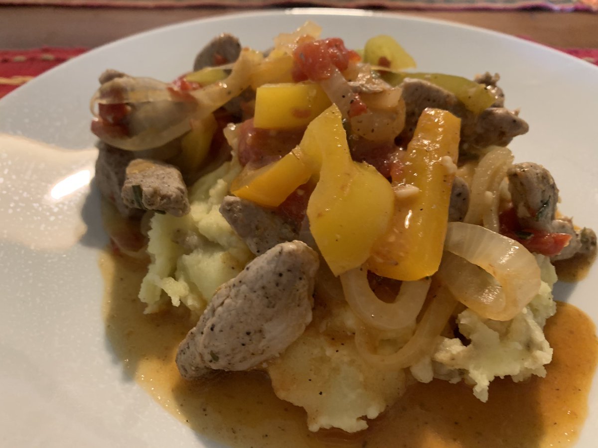 Tonight, despite a head injury, I made quick braised pork with peppers and onions on a bed of goat cheese mashed potatoes.