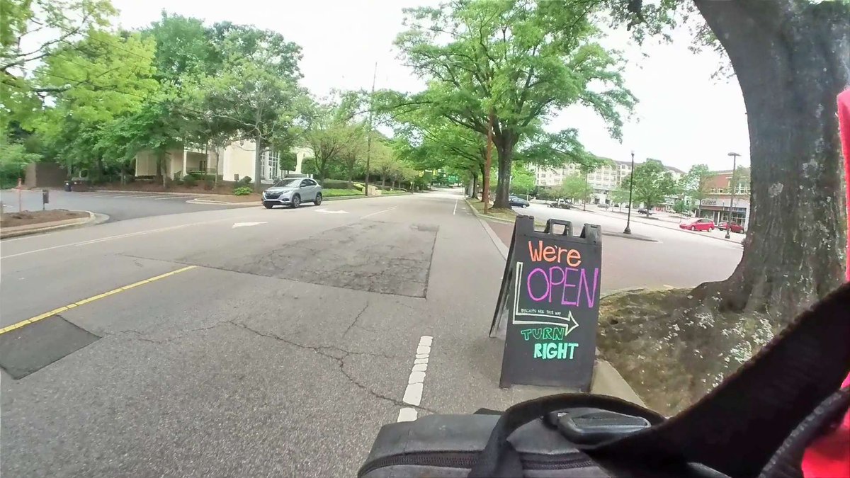 1) It helps to identify the "We" in "We're open" I guess the biscuits are a clue, <a href="/FlyingBiscuit_R/">Flying Biscuit</a>?
2) Don't put your signs in the bike lane! Why would anyone even think that's an option?