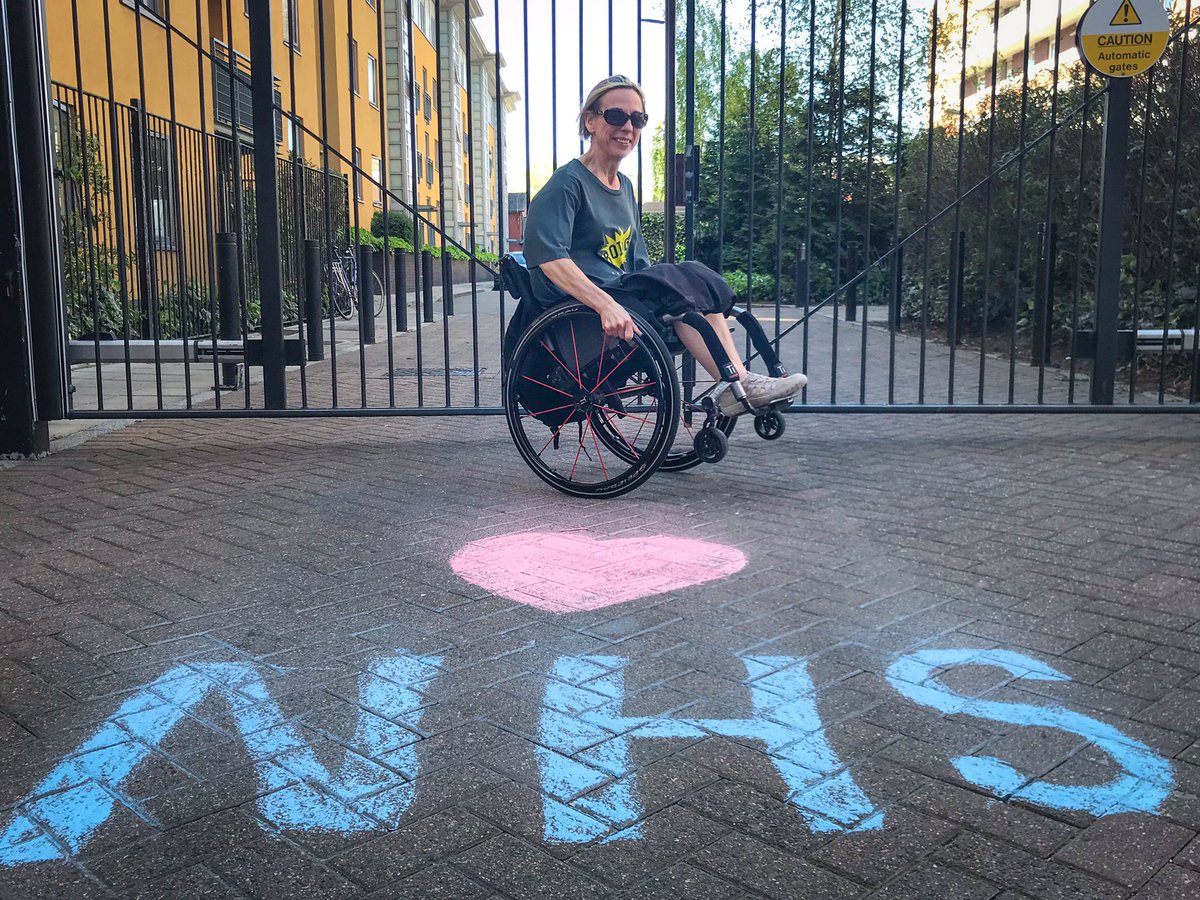 Mandi asked me to come and take her picture and when she came to her gate we found this  #ThankYouNHS chalk. Ellen did a jump for her portrait. Not to be outdone, Mandi pulled a wheelie. #LoveInATimeOfIsolation #LoveInATimeOfCorona #DoorstepPortraits  https://www.instagram.com/p/B_MRDK4nOMV/?igshid=v4losma0nifw