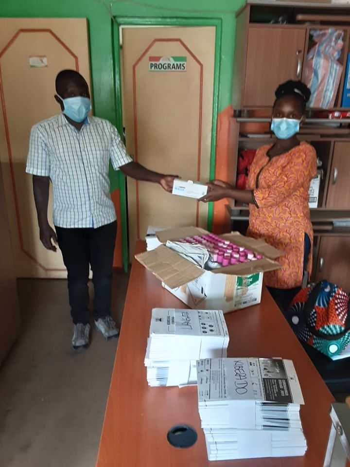 ActioNetwork's tweet photo. Our Advocacy Officer Ms. Florence handing over hand sanitizers, face masks and posters (IEC) to Lang'ata Sub county Medical Officer of Health (MOH) to support the fight against #Covid19. #ItalianDevelopmentCooperation #YWNWA @CallAfrica #NoOneOut #StayHomekenya #FlattenTheCurve https://t.co/nXiocraTei