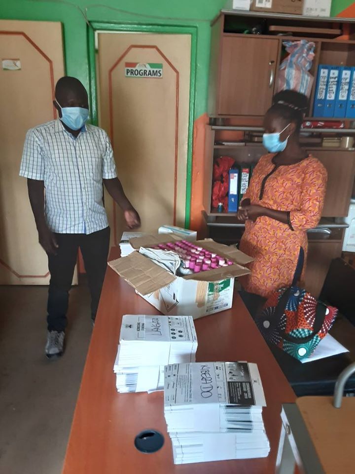 ActioNetwork's tweet photo. Our Advocacy Officer Ms. Florence handing over hand sanitizers, face masks and posters (IEC) to Lang'ata Sub county Medical Officer of Health (MOH) to support the fight against #Covid19. #ItalianDevelopmentCooperation #YWNWA @CallAfrica #NoOneOut #StayHomekenya #FlattenTheCurve https://t.co/nXiocraTei