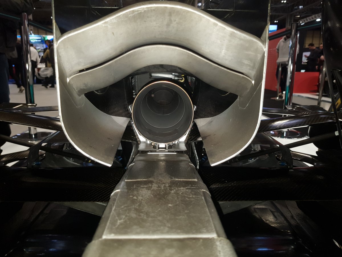 For 2014 the new power units had to place their turbo exhausts up centrally over the gearbox. Unable to route down towards the diffuser, the rear wing became the target, the gasses were blown through the monkey seat winglet to upwash up under the rear wing for a little downforce